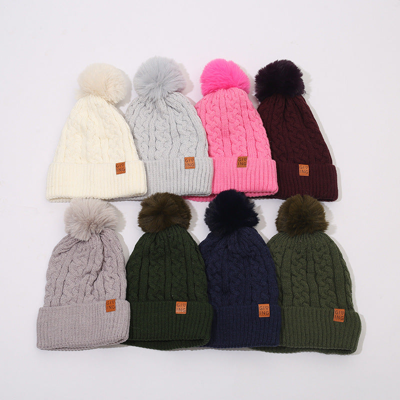Gorro trenzado forrado con pompón de pelo