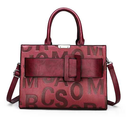 Bolso de mano con letras