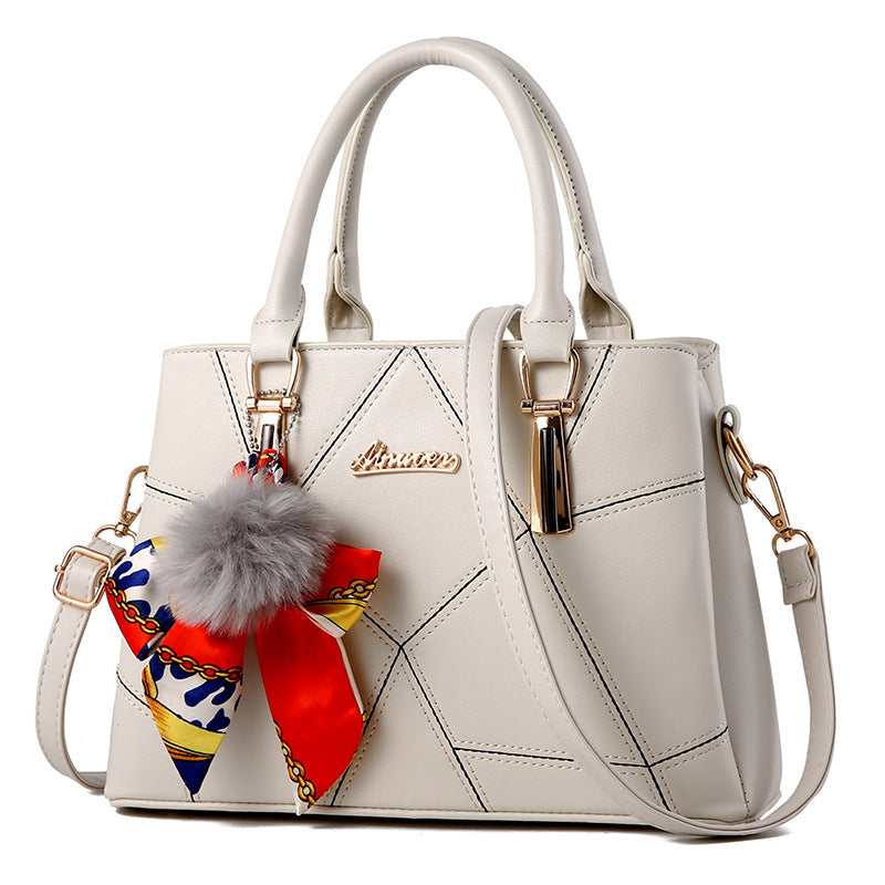 Bolso de mano con colgante de pelo – foto 8