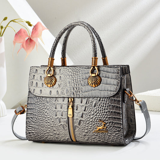 Bolso de mano efecto cocodrilo