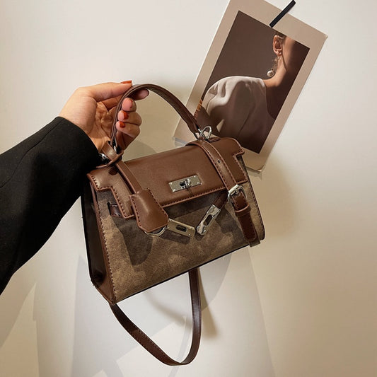 Bolso de mano bicolor