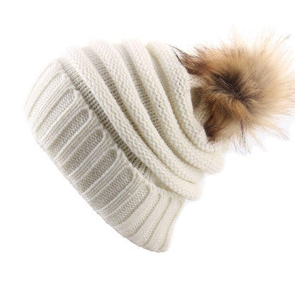 Gorro con vuelta y pompón de pelo