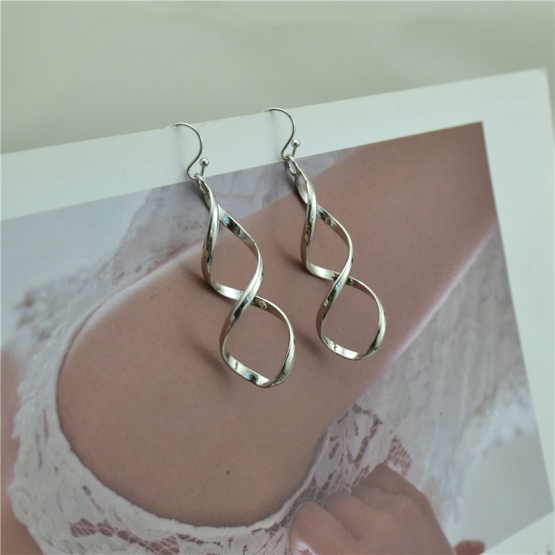 Pendientes trenzados de plata en espiral – foto 3